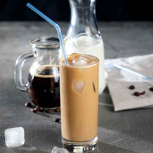Cold iced coffee drink with ingredients to make it